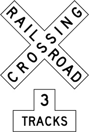 What does a "3 TRACKS" sign below a crossbuck mean?